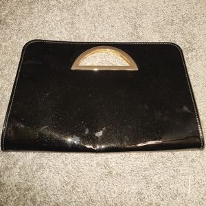 Black patented leather clutch